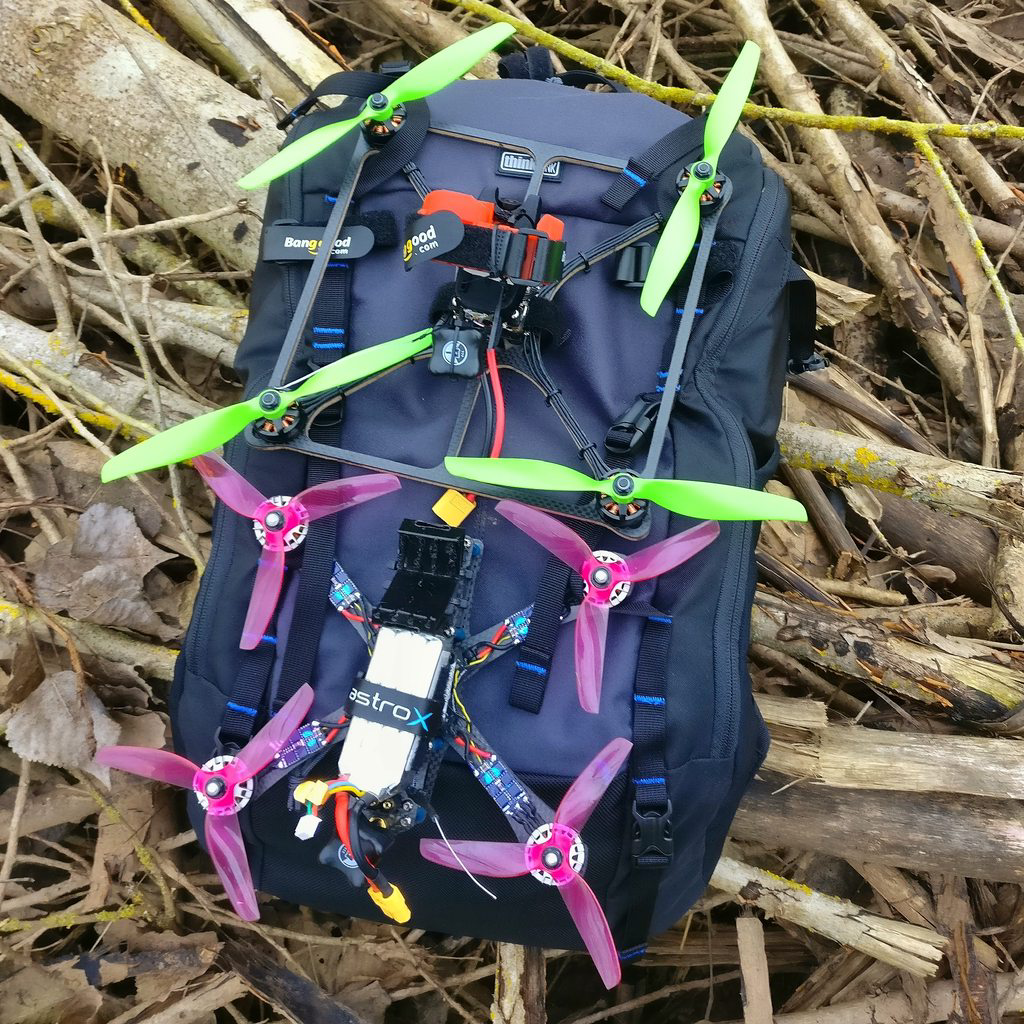 Two very different quads strapped to the backpack